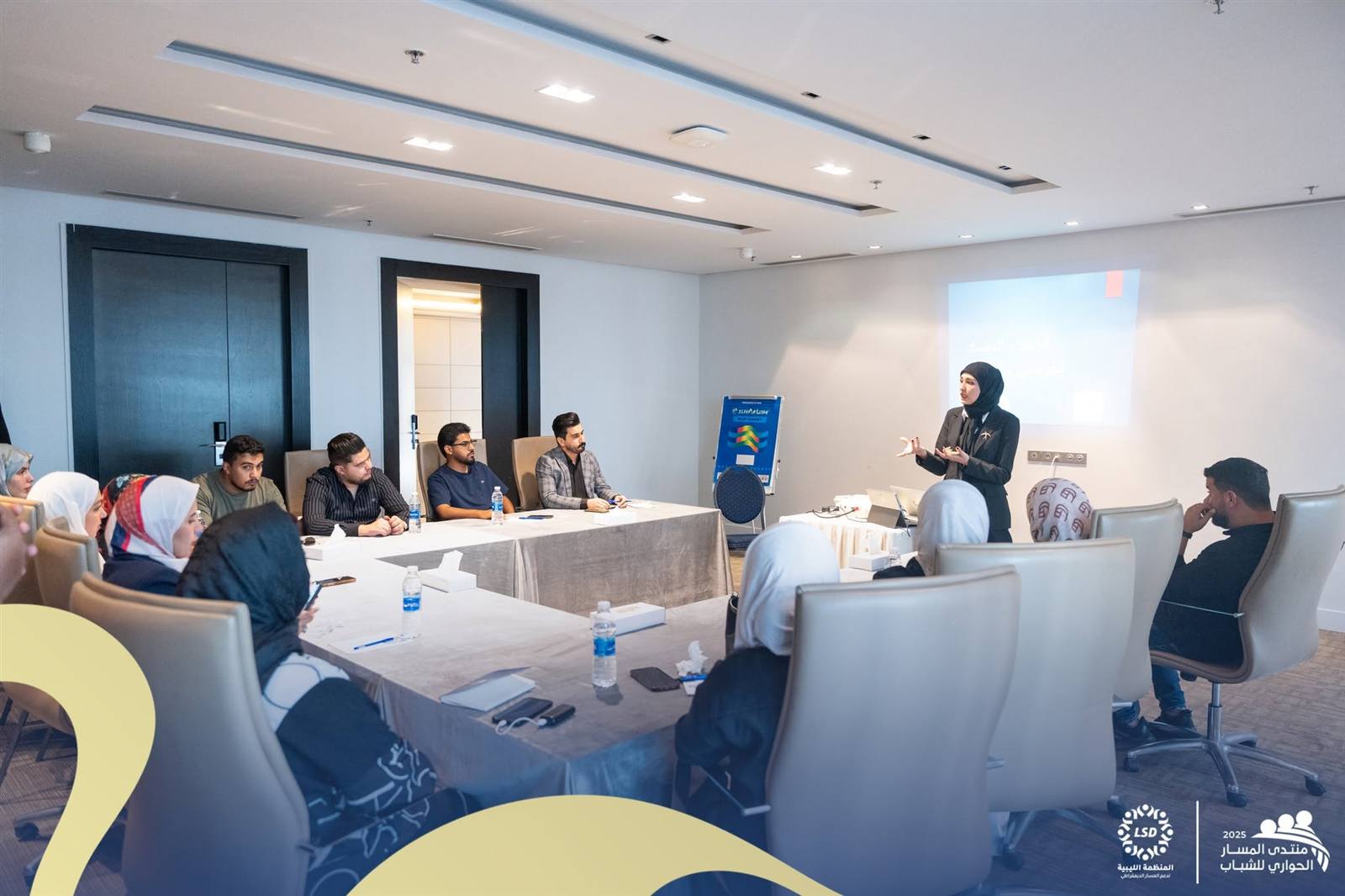 A facilitator leads a breakout discussion
